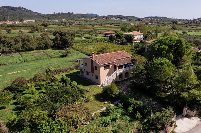 Aerial view of Selini Villa in Kalithea surrounded by green landscape and countryside