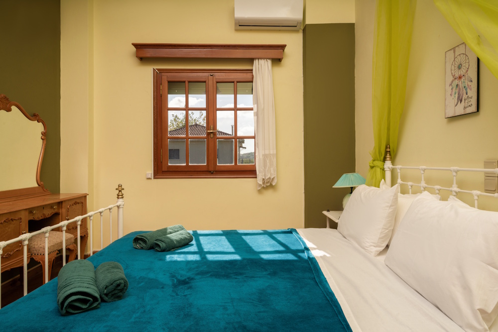 Double bedroom with natural light at Selini Villa in Kalithea