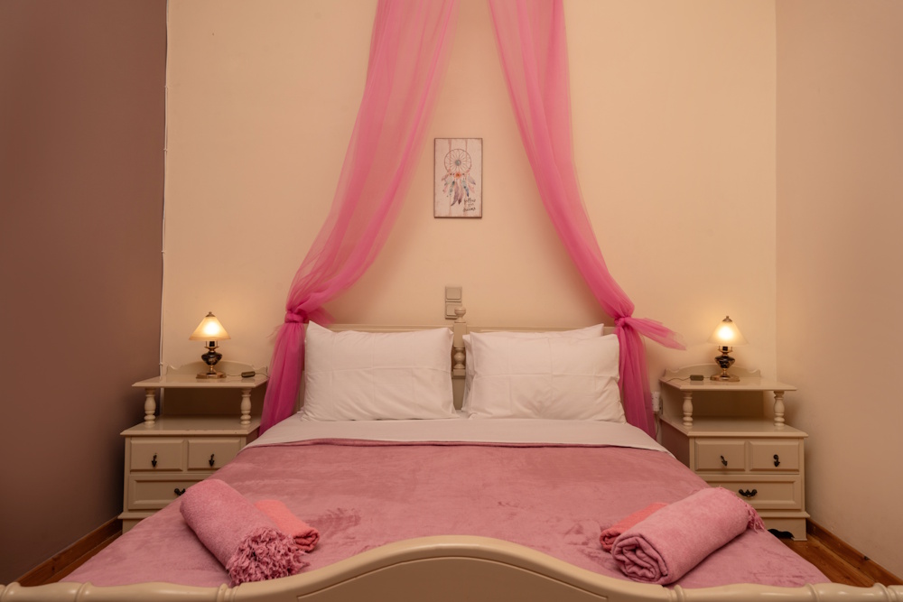 Double bedroom with soft decor at Selini Villa in Kalithea